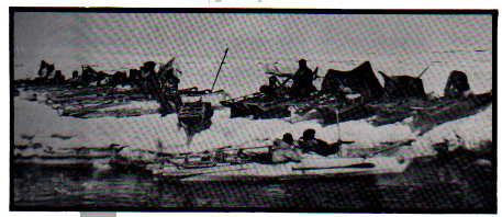 Kayaks lined up on the ice not far from Hooper Bay. Taken during the Spring seal hunt in 1947.